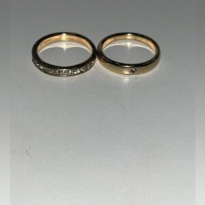 Two size 6 gold rings with jewels on them.
